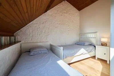 Un ou plusieurs lits dans un hébergement de l'établissement Gîte 8 chambres entre Reims et Epernay - La Chenevière - Gîtes Au Beau Sarrazin