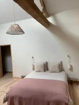 Un ou plusieurs lits dans un hébergement de l'établissement Gite La Famille 4 etoiles Domaine Grange Lecomte
