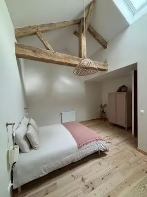 Un ou plusieurs lits dans un hébergement de l'établissement Gite La Famille 4 etoiles Domaine Grange Lecomte
