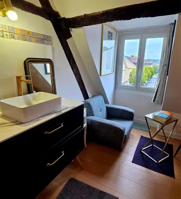 Un ou plusieurs lits dans un hébergement de l'établissement Château Compiegne Duplex et parking