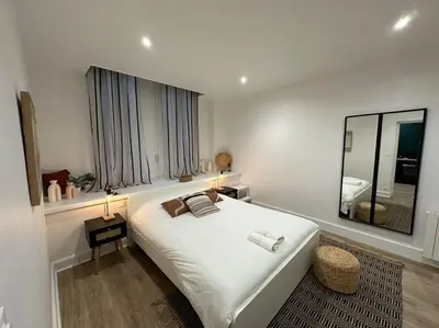Un ou plusieurs lits dans un hébergement de l'établissement Santa Fe, appartement neuf proche du centre-ville