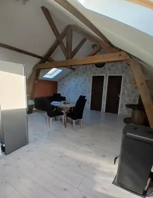 Coin salon dans l'établissement Le gîte du Château d'eau - Larouillies