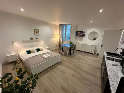 Un ou plusieurs lits dans un hébergement de l'établissement Acapulco, studio spacieux rénové