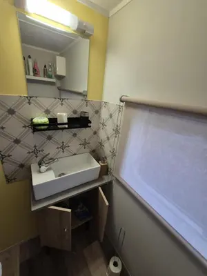 Salle de bains dans l'établissement Mobil-Home N 48