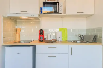 Cuisine ou kitchenette dans l'établissement ZenkaSerenity 2- 3 min Gare-IUT-wifi-Centre, Tout confort