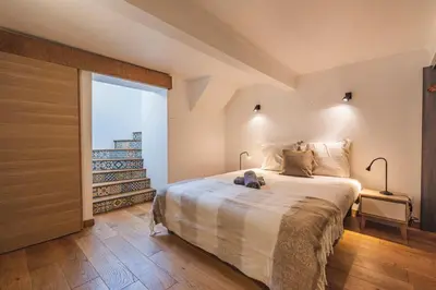 Un ou plusieurs lits dans un hébergement de l'établissement Loft urbain avec jardin privé en hyper centre