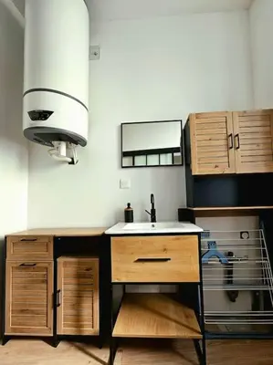 Cuisine ou kitchenette dans l'établissement La Perle Bleue