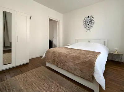 Un ou plusieurs lits dans un hébergement de l'établissement Appartement à Reims - Wi-Fi & Netflix