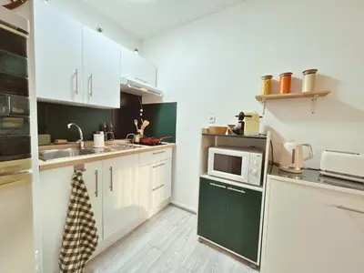 Cuisine ou kitchenette dans l'établissement Le Petit Margny - 8mn de la gare, place de parking sécurisée - Your Sweet Loc