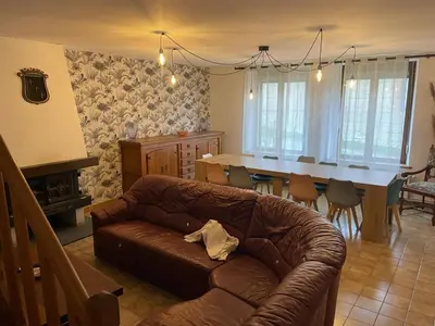 Coin salon dans l'établissement Gîte grande capacité Fléville,la sérénité de Jeannot