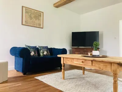 Télévision ou salle de divertissement dans l'établissement L'Ecrin de la Chapelle