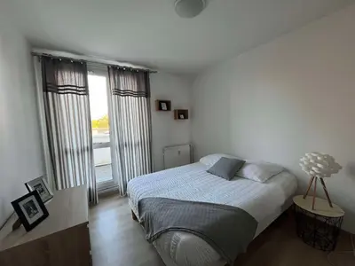 Un ou plusieurs lits dans un hébergement de l'établissement Duplex urbain spacieux à Compiègne