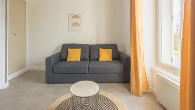 Coin salon dans l'établissement Sunshine - Appartement neuf - parking