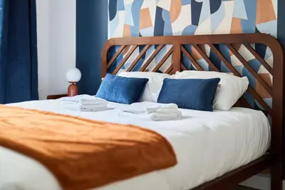 Un ou plusieurs lits dans un hébergement de l'établissement MM Suites Town House Terrasse