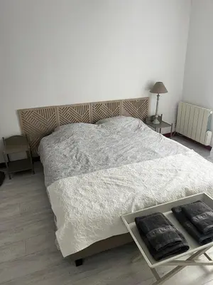 Un ou plusieurs lits dans un hébergement de l'établissement Appartement centre ville proche Roissy CDG