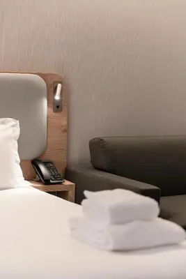 Un ou plusieurs lits dans un hébergement de l'établissement Holiday Inn Express & Suites Reims - Rives de Vesle by IHG