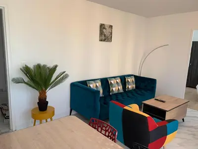 Coin salon dans l'établissement Chambres ou Appartement Cosy