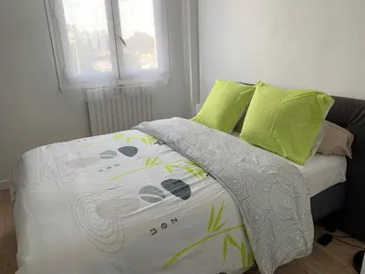 Un ou plusieurs lits dans un hébergement de l'établissement Chambres ou Appartement Cosy