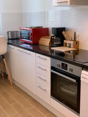 Cuisine ou kitchenette dans l'établissement Chambres ou Appartement Cosy