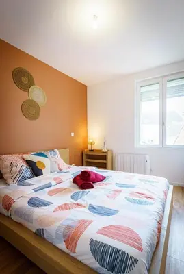 Un ou plusieurs lits dans un hébergement de l'établissement Appartement Royal séjour, Parking gratuit