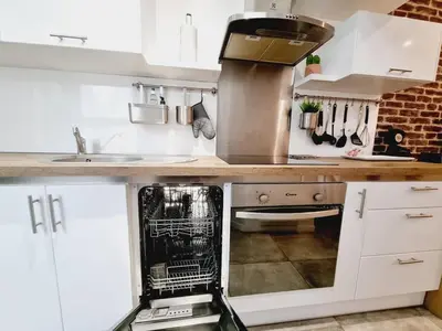 Cuisine ou kitchenette dans l'établissement Saun arene grand T2 proche gare avec sauna