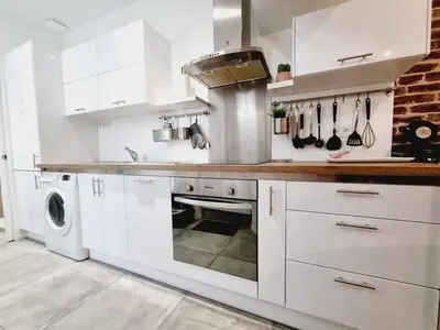 Cuisine ou kitchenette dans l'établissement Saun arene grand T2 proche gare avec sauna