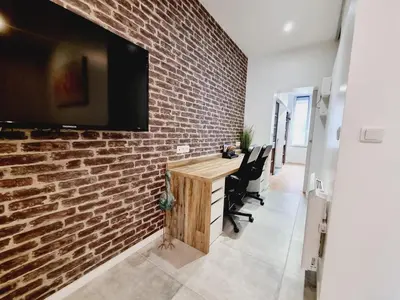 Télévision ou salle de divertissement dans l'établissement Saun arene grand T2 proche gare avec sauna