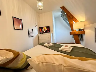 Un ou plusieurs lits dans un hébergement de l'établissement S Baylevéd'Air duplex vue château, Balnéo et sauna