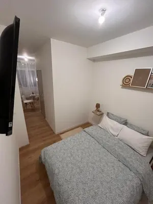 Un ou plusieurs lits dans un hébergement de l'établissement Serenity Stay