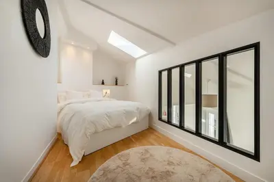 Un ou plusieurs lits dans un hébergement de l'établissement Le Petit Saint Martin - Duplex - Cœur de ville