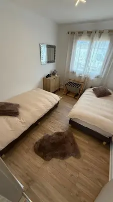 Un ou plusieurs lits dans un hébergement de l'établissement Maison cosy à Moyvillers classée de tourisme 3 étoiles