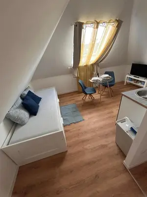 Un ou plusieurs lits dans un hébergement de l'établissement Cozy studio 5