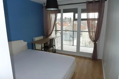 Un ou plusieurs lits dans un hébergement de l'établissement Appartement Venise 2 chambres