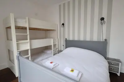 Un ou plusieurs lits dans un hébergement de l'établissement E Le clos des lumières, maison 13 pers avec jardin
