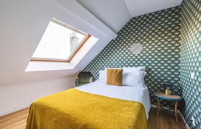 Un ou plusieurs lits dans un hébergement de l'établissement Appartement centre-ville Reims vue Cathédrale