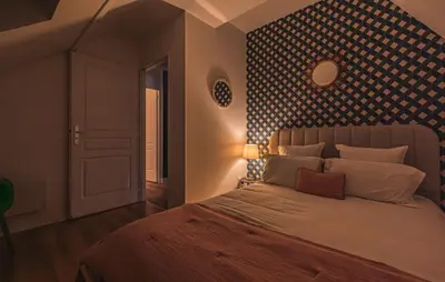 Un ou plusieurs lits dans un hébergement de l'établissement Appartement centre-ville Reims vue Cathédrale