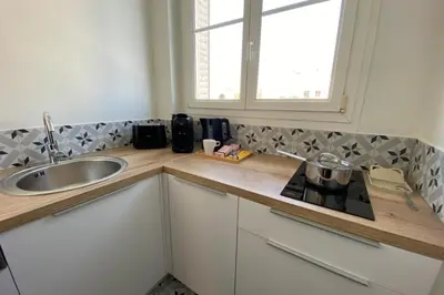 Cuisine ou kitchenette dans l'établissement Apart'Champagne Les Deux Ponts station & center