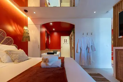 Un ou plusieurs lits dans un hébergement de l'établissement Suite bien être - Sauna & Spa privatif - Baliroom Château Thierry
