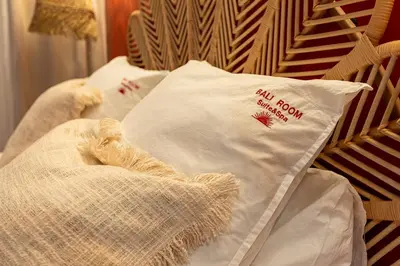 Un ou plusieurs lits dans un hébergement de l'établissement Suite bien être - Sauna & Spa privatif - Baliroom Château Thierry