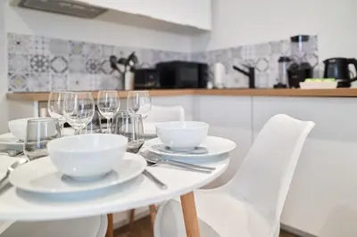 Cuisine ou kitchenette dans l'établissement Le Raffiné Centre Ville