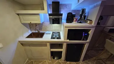 Cuisine ou kitchenette dans l'établissement La Suite Tilleul
