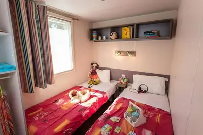 Un ou plusieurs lits dans un hébergement de l'établissement Camping Le Chêne Gris