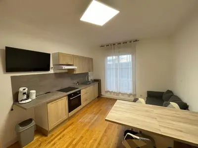Cuisine ou kitchenette dans l'établissement Logement 1 à 5 personnes
