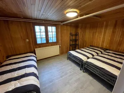 Un ou plusieurs lits dans un hébergement de l'établissement Villa 21 couchages avec piscine interieure chauffée