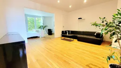 Coin salon dans l'établissement Appart SPA 80m2 avec terrasse balcon jacuzzi et sauna privatif en hyper centre Place Drouet d'Erlon