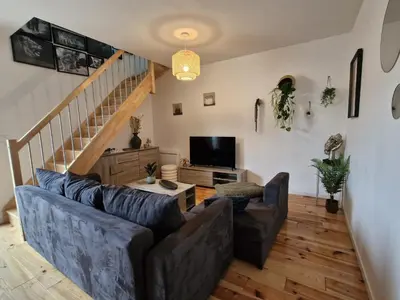 Télévision ou salle de divertissement dans l'établissement La grange de l'Ailette