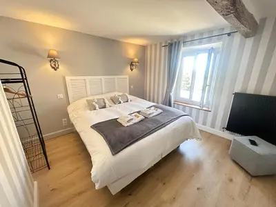 Un ou plusieurs lits dans un hébergement de l'établissement Au clos de jean un havre de paix avec 3 chambres