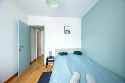 Un ou plusieurs lits dans un hébergement de l'établissement Calme Appart - Centre ville - Cozy Houses