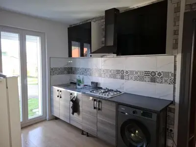 Cuisine ou kitchenette dans l'établissement Appartement cosy