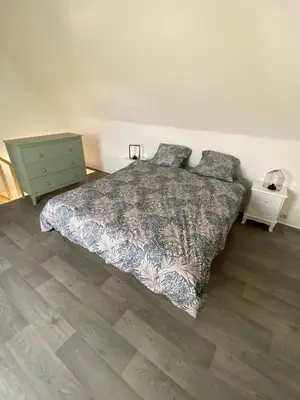 Un ou plusieurs lits dans un hébergement de l'établissement Jolie duplex avec vue sur forêt
